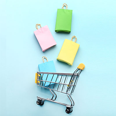 Shopping trolley and bags symbolic of online shopping