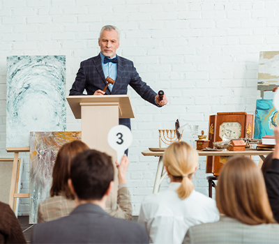 An auctioneer at a location