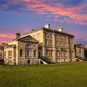A grand stone house in the countryside