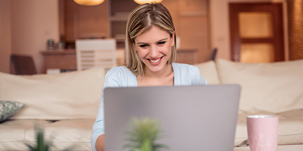 Woman looking at her insurance policy on her laptop