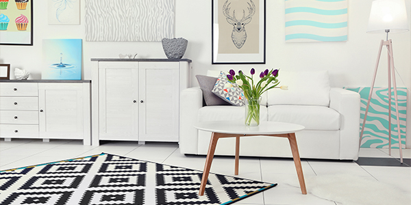 Room with contents: sofa, table and rug