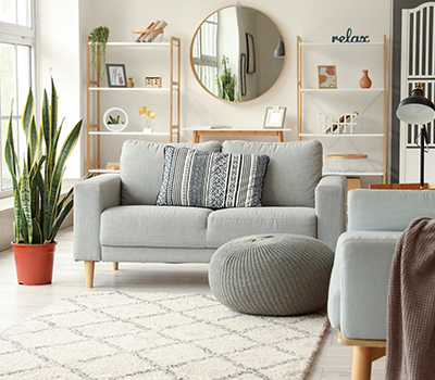 A grey sofa in a modern sitting room that could be at risk of underinsurance